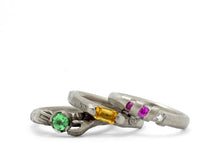 Load image into Gallery viewer, Fraser Hamilton Jewellery | 'Bubblegum' White gold band ring with pink sapphires and a diamond sat with two other rings.